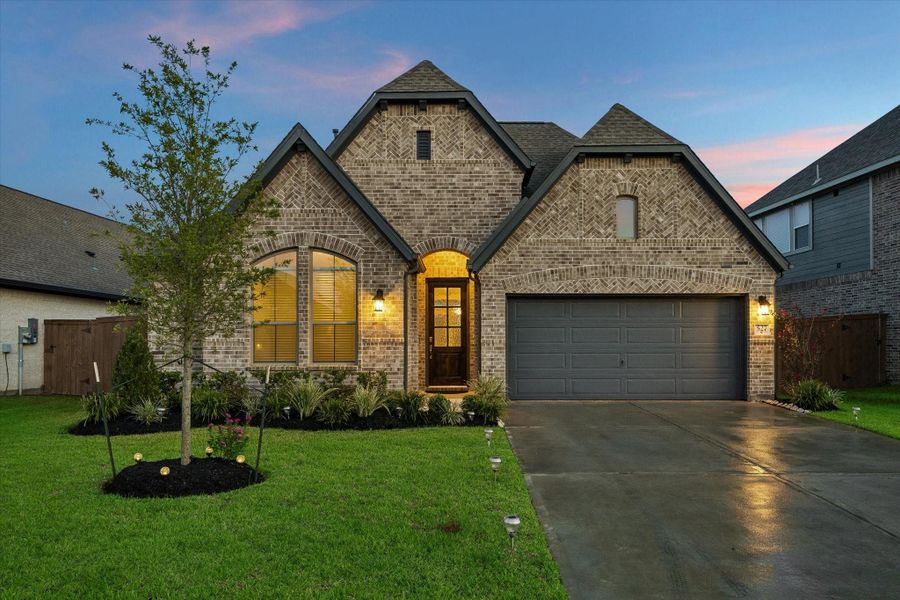 Front exterior of a new home in Edgewater, Webster, TX, highlighting curb appeal (Image 1). Front exterior of a new home in Edgewater, Webster, TX, highlighting curb appeal (Image 1).