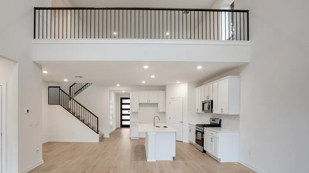 Furnished interior view inside a new home in Prairie Oaks, Oak Point (Image 4).