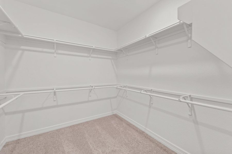 A view of your large primary walk-in Closet