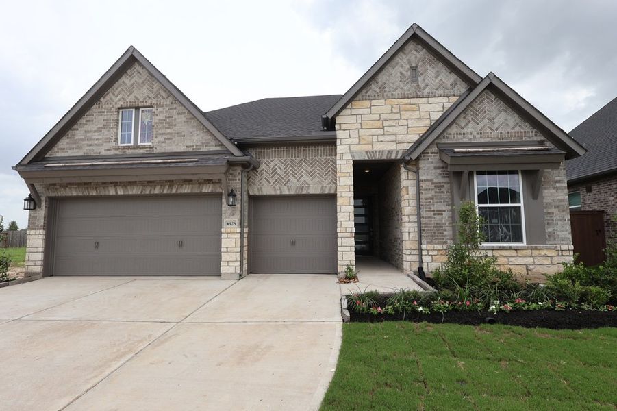 Front exterior of a new home in Brookewater - Ascent Collection, Rosenberg, TX, highlighting curb appeal (Image 1). Front exterior of a new home in Brookewater - Ascent Collection, Rosenberg, TX, highlighting curb appeal (Image 1).