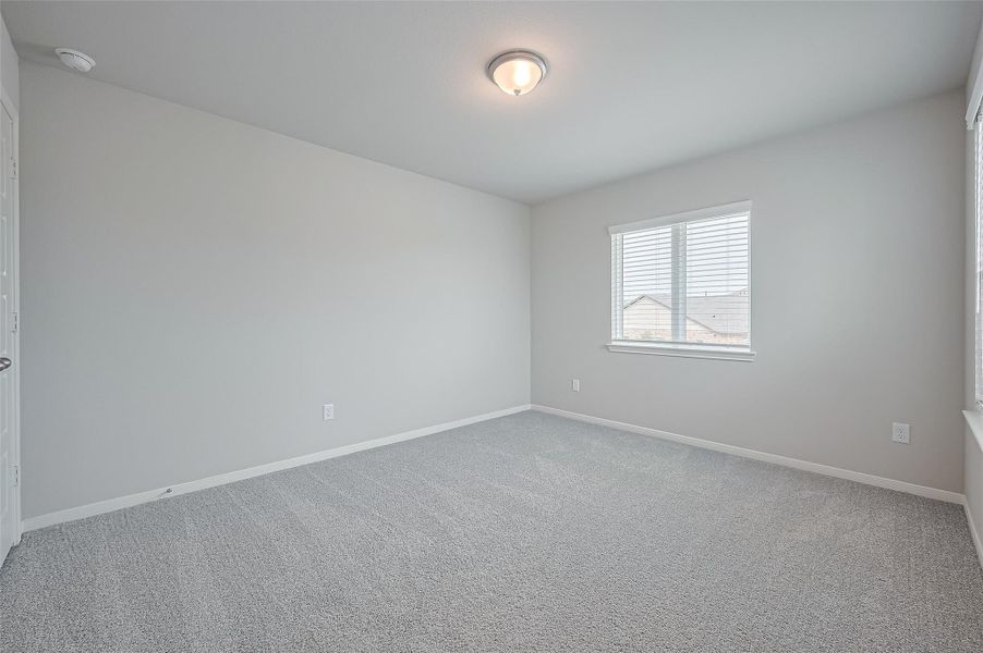 Spacious, unfurnished interior of a new home in Sunterra, Katy (Image 39).