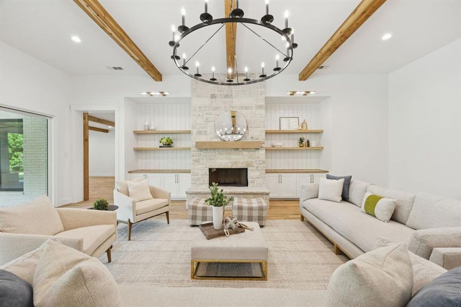Secondary living room features a gorgeous stone fireplace with raised hearth framed by floating shelves. Secondary living room features a gorgeous stone fireplace with raised hearth framed by floating shelves.