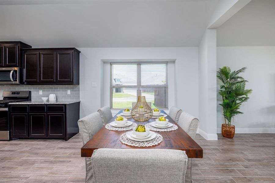 Dining space featuring wood finish floors
