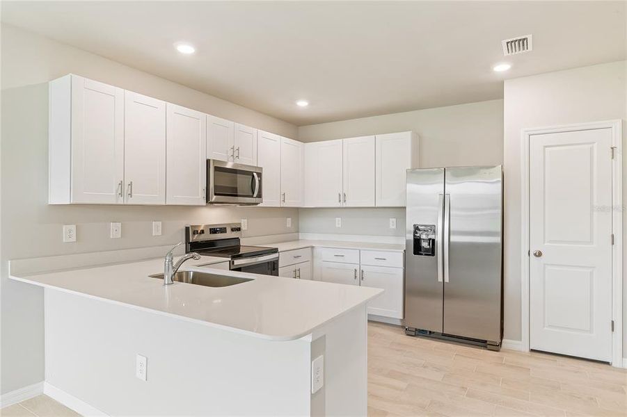 Furnished interior view inside a new home in Heritage Lake Park, Punta Gorda (Image 4).
