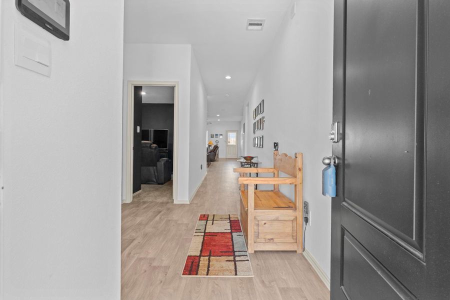 Step inside to a bright, open foyer featuring soaring ceilings, gorgeous carefree wood vinyl plank floors, and neutral colors that instantly feel fresh and welcoming. This spacious entryway sets the tone for the rest of the home — light, airy, and thoughtfully designed. Step inside to a bright, open foyer featuring soaring ceilings, gorgeous carefree wood vinyl plank floors, and neutral colors that instantly feel fresh and welcoming. This spacious entryway sets the tone for the rest of the home — light, airy, and thoughtfully designed.