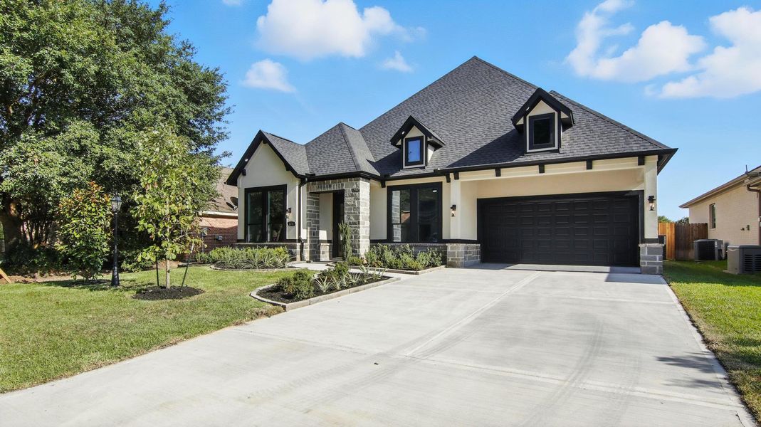 Front exterior of a new home in , Montgomery, TX, highlighting curb appeal (Image 22). Front exterior of a new home in , Montgomery, TX, highlighting curb appeal (Image 22).