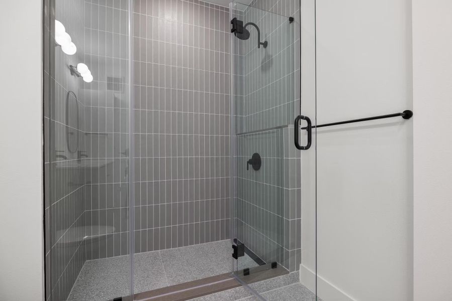 Full bath featuring a shower stall