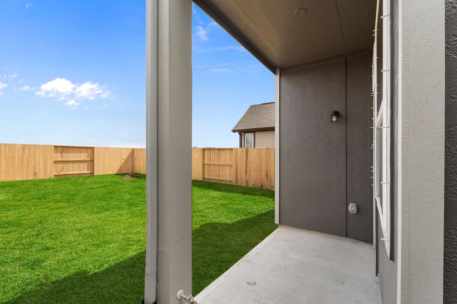 Exterior details and patio area of a home in Bridgeland, Cypress (Image 24).