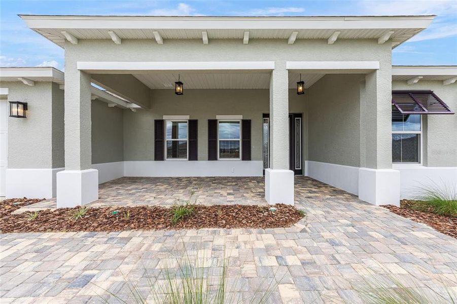 Front exterior of a new home in On Top of the World Communities, Ocala, FL, highlighting curb appeal (Image 13).