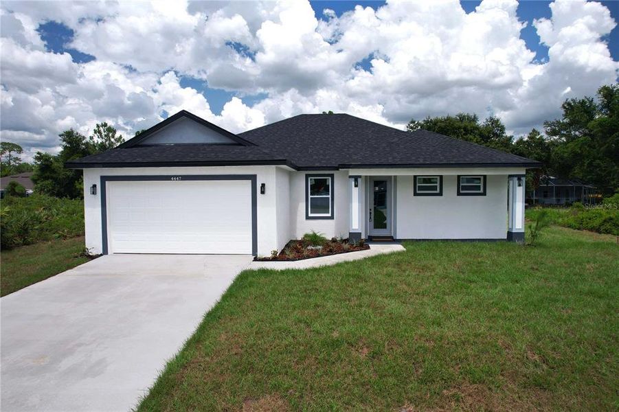 Front exterior of a new home in , North Port, FL, highlighting curb appeal (Image 1).