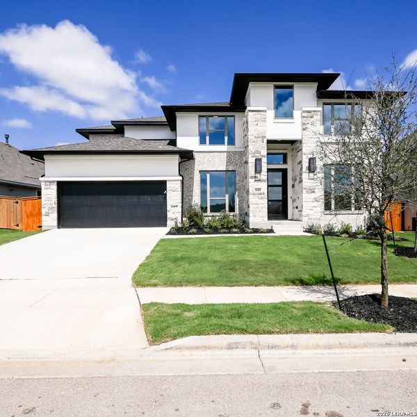 Front exterior of a new home in Veramendi, New Braunfels, TX, highlighting curb appeal (Image 23).