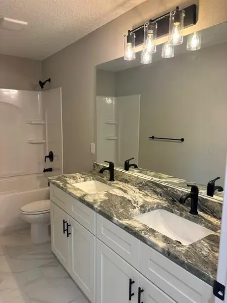 Furnished interior view inside a new home in , Dunnellon (Image 9).