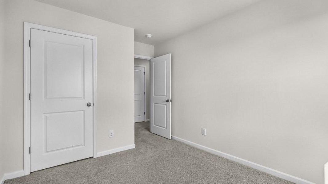 Spacious, unfurnished interior of a new home in Edinborough Townes, Gibsonville (Image 15).