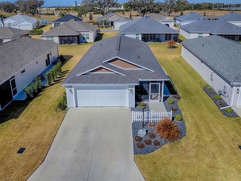 Front exterior of a new home in , The Villages, FL, highlighting curb appeal (Image 25).
