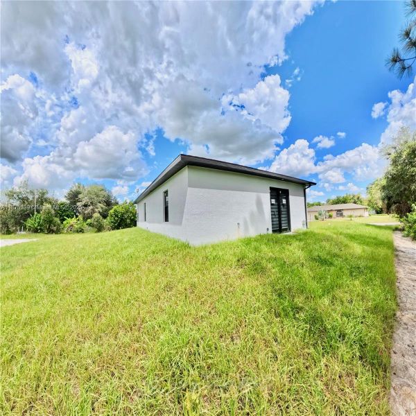 Exterior details and patio area of a home in , Lehigh Acres (Image 4). Exterior details and patio area of a home in , Lehigh Acres (Image 4).