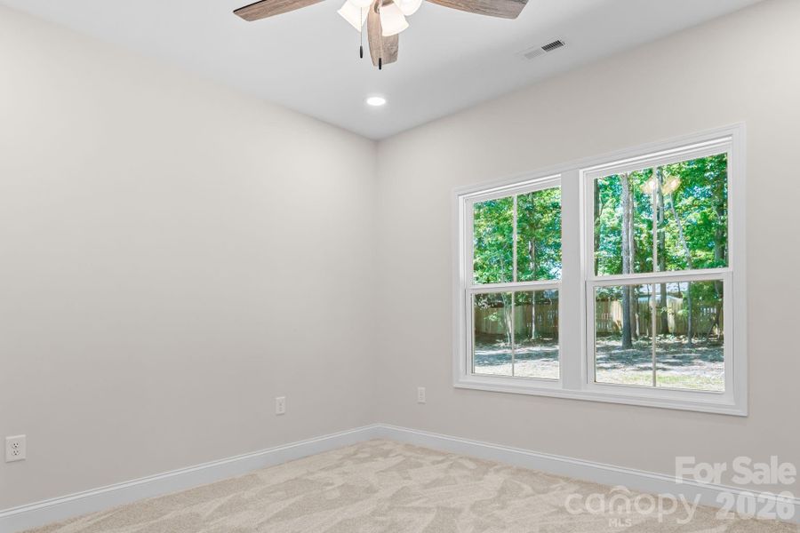 Primary Bedroom with ceiling fan