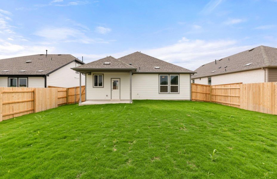 Front exterior of a new home in Patterson Ranch, Georgetown, TX, highlighting curb appeal (Image 28). Front exterior of a new home in Patterson Ranch, Georgetown, TX, highlighting curb appeal (Image 28).
