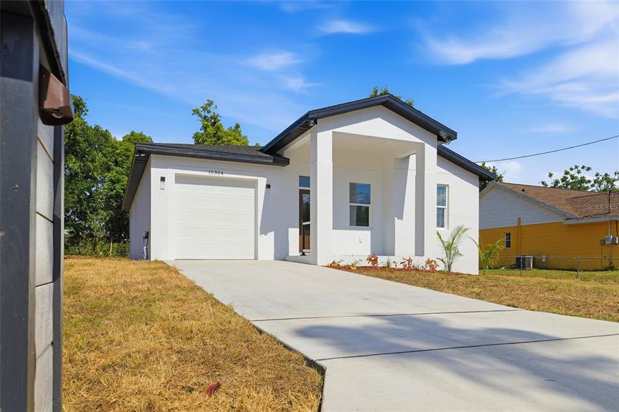 Front exterior of a new home in , Dade City, FL, highlighting curb appeal (Image 20).