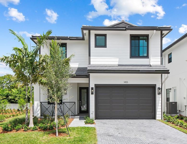 Front exterior of a new home in Marina Landings, Fort Lauderdale, FL, highlighting curb appeal (Image 1).
