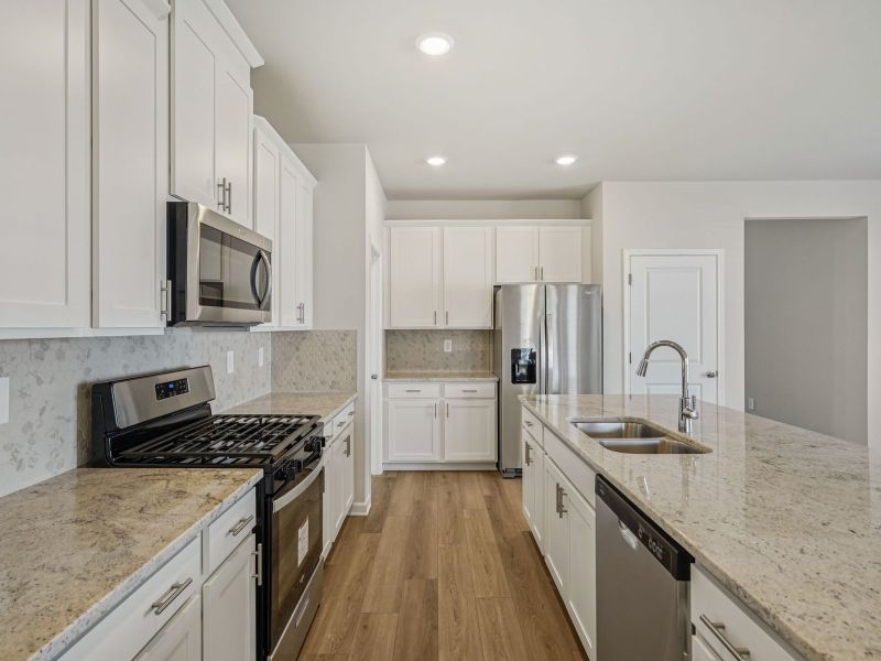 Furnished interior view inside a new home in Northwoods at Mirror Lake, Villa Rica (Image 7).