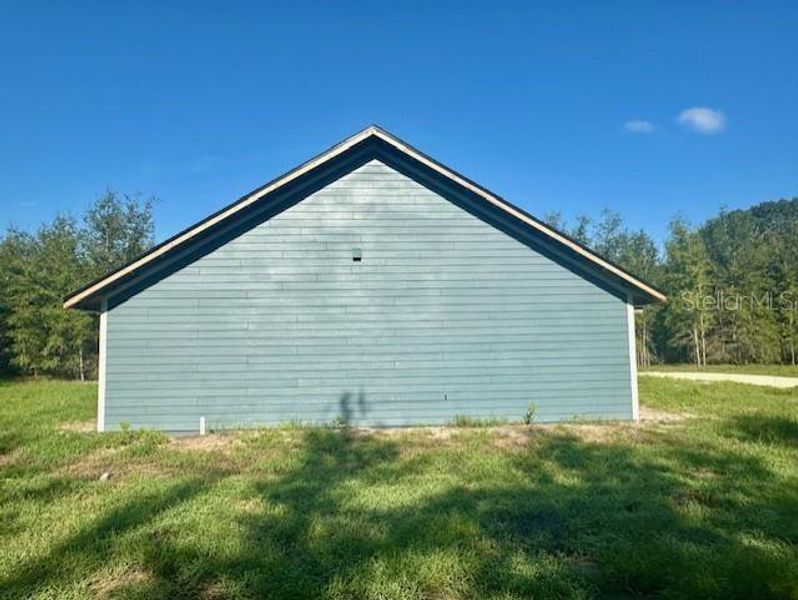 Front exterior of a new home in , Bell, FL, highlighting curb appeal (Image 8). Front exterior of a new home in , Bell, FL, highlighting curb appeal (Image 8).