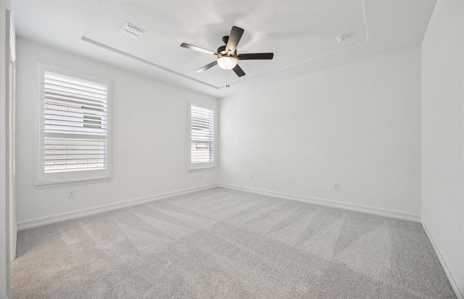 Spacious owner's suite with natural light.