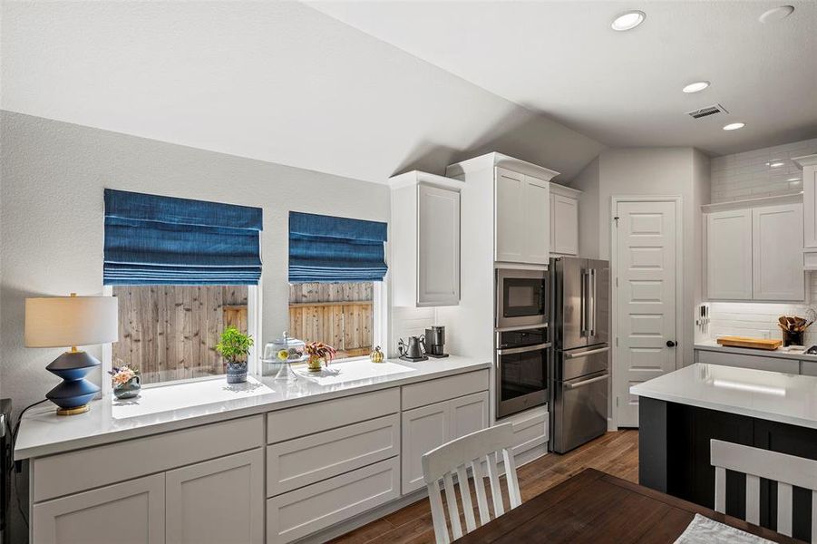 This built in cabinet is great for storage and a great place for a coffee bar