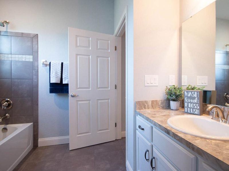 A hall bath serves bedroom 4 and guests - Waylyn home plan by Highland Homes