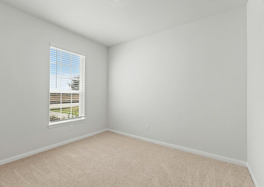 Bedroom with a window overlooking the front yard Bedroom with a window overlooking the front yard