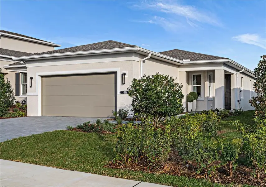 Front exterior of a new home in , Lady Lake, FL, highlighting curb appeal (Image 1). Front exterior of a new home in , Lady Lake, FL, highlighting curb appeal (Image 1).