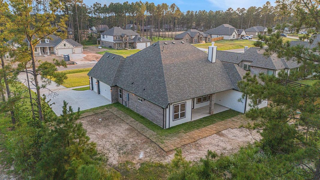 Front exterior of a new home in Deer Pines, Conroe, TX, highlighting curb appeal (Image 1). Front exterior of a new home in Deer Pines, Conroe, TX, highlighting curb appeal (Image 1).