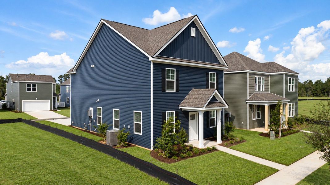 Front exterior of a new home in The Cove at Mallard Crossing, Summerville, SC, highlighting curb appeal (Image 10). Front exterior of a new home in The Cove at Mallard Crossing, Summerville, SC, highlighting curb appeal (Image 10).