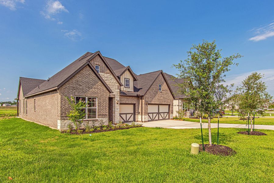Front exterior of a new home in WaterStone, Montgomery, TX, highlighting curb appeal (Image 2). Front exterior of a new home in WaterStone, Montgomery, TX, highlighting curb appeal (Image 2).
