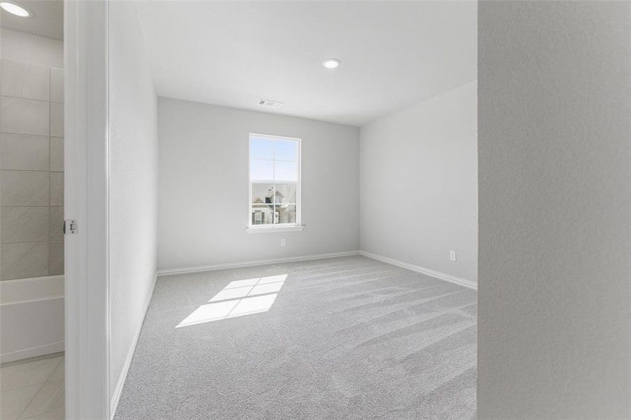 Unfurnished room with light carpet and recessed lighting