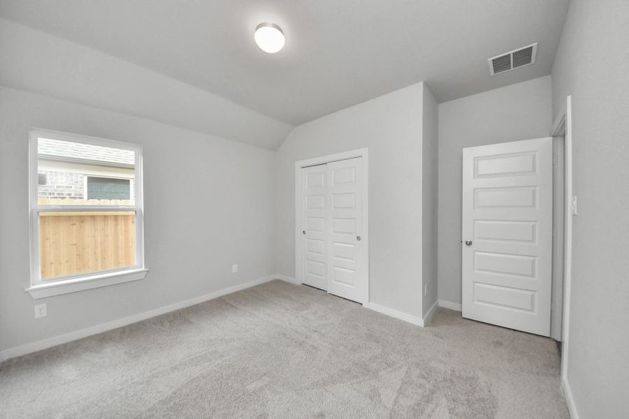 Generously sized secondary bedrooms, complete with spacious closets and soft, inviting carpeting. Enjoy abundant natural light streaming in through the large windows, complemented by privacy blinds for your personal sanctuary. Sample photo of completed home with similar floor plan. Actual colors and selections may vary. Generously sized secondary bedrooms, complete with spacious closets and soft, inviting carpeting. Enjoy abundant natural light streaming in through the large windows, complemented by privacy blinds for your personal sanctuary. Sample photo of completed home with similar floor plan. Actual colors and selections may vary.