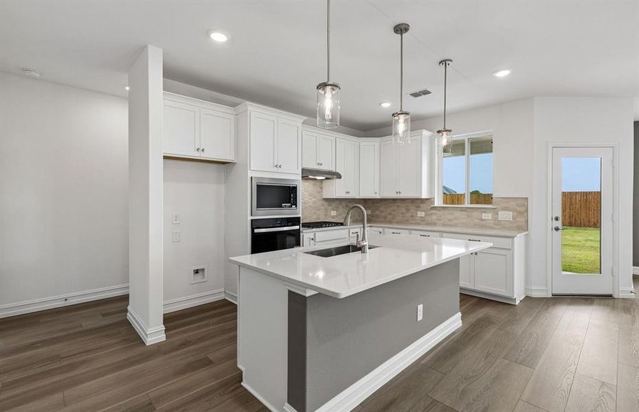Kitchen with eat in bartop island