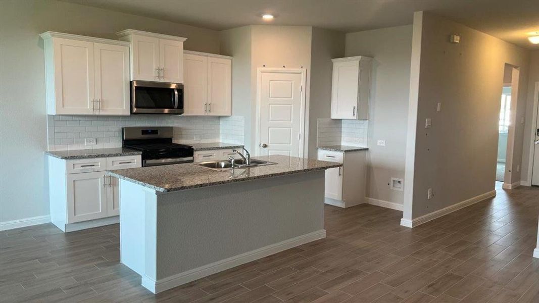 Kitchen- All Home and community information, including pricing, included features, terms, availability and amenities, are subject to change at any time without notice or obligation. All Drawings, pictures, photographs, video, square footages, floor plans, elevations, features, colors and sizes are approximate for illustration purposes only and will vary from the homes as built.