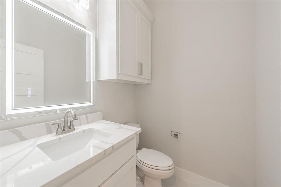 Bathroom with vanity and toilet