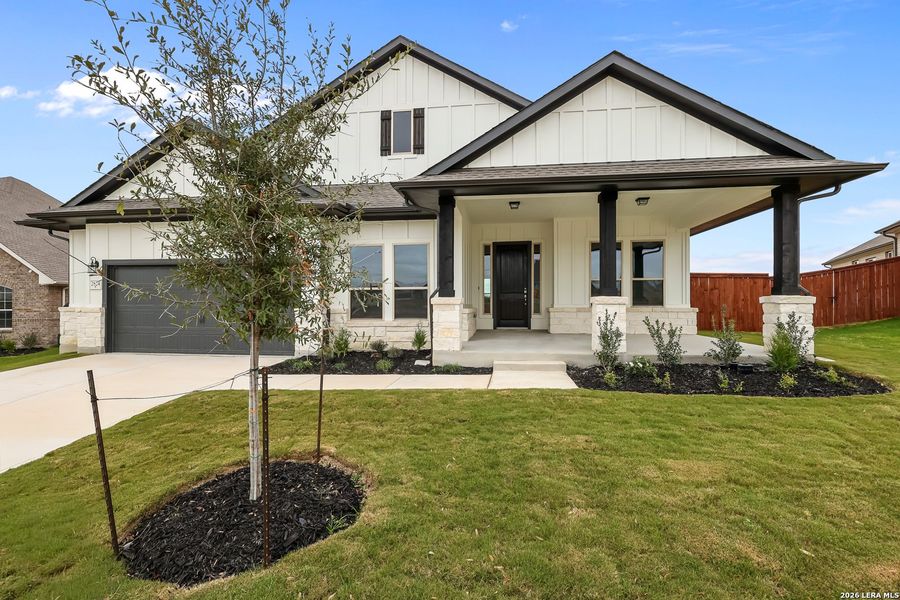 Front exterior of a new home in Homestead 75', Schertz, TX, highlighting curb appeal (Image 2). Front exterior of a new home in Homestead 75', Schertz, TX, highlighting curb appeal (Image 2).