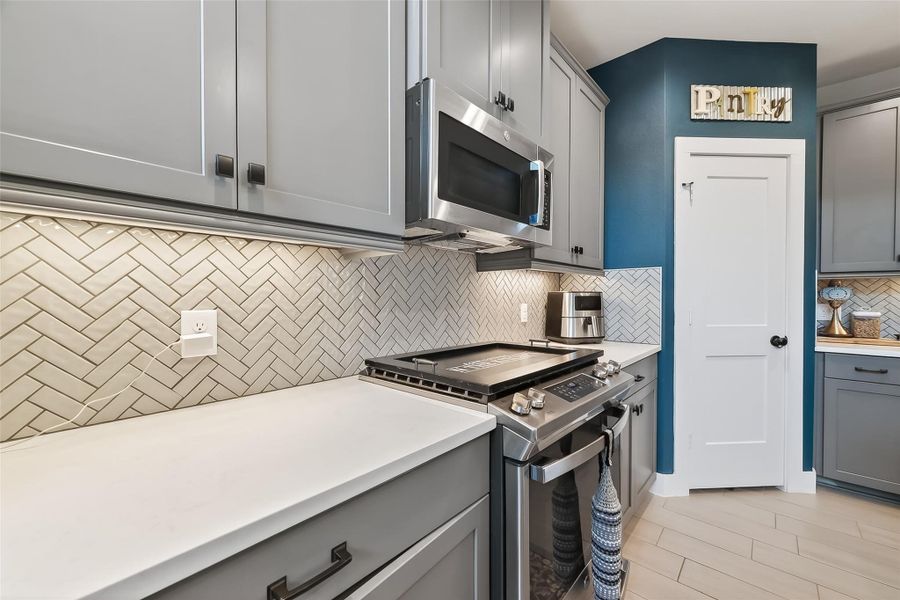 Upgraded herringbone tile is just 1 example of many upgrades chosen during the designing of this home