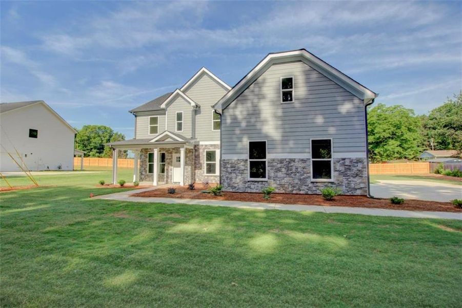 Front exterior of a new home in , Covington, GA, highlighting curb appeal (Image 2). Front exterior of a new home in , Covington, GA, highlighting curb appeal (Image 2).