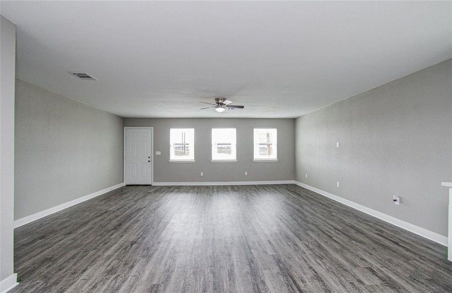 Expansive main living area offering flexibility for entertaining, relaxing, and everyday living.