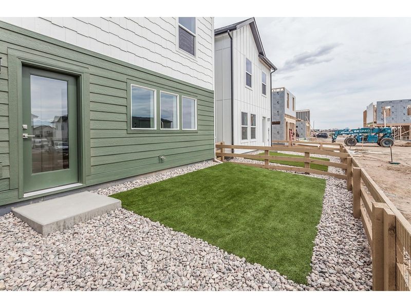 Exterior details and patio area of a home in Bloom Trailblazer Collection - Single Family Homes, Fort Collins (Image 24). Exterior details and patio area of a home in Bloom Trailblazer Collection - Single Family Homes, Fort Collins (Image 24).
