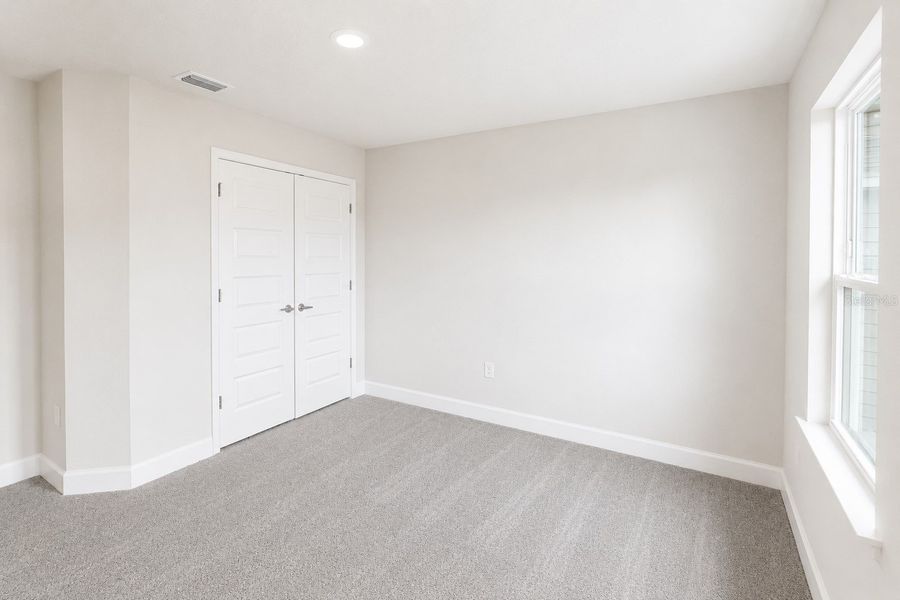 Spacious, unfurnished interior of a new home in Harmony Central, St. Cloud (Image 21).