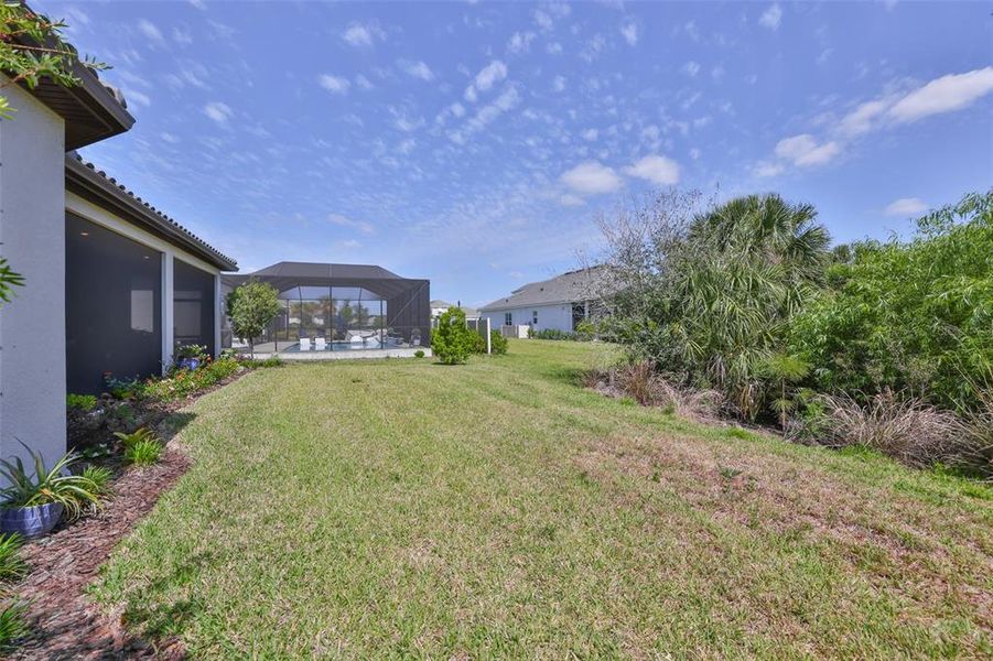 Exterior details and patio area of a home in Esplanade at Artisan Lakes, Palmetto (Image 26).