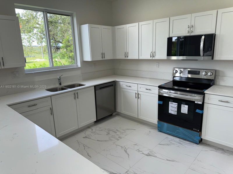 Furnished interior view inside a new home in , Homestead (Image 5). Furnished interior view inside a new home in , Homestead (Image 5).