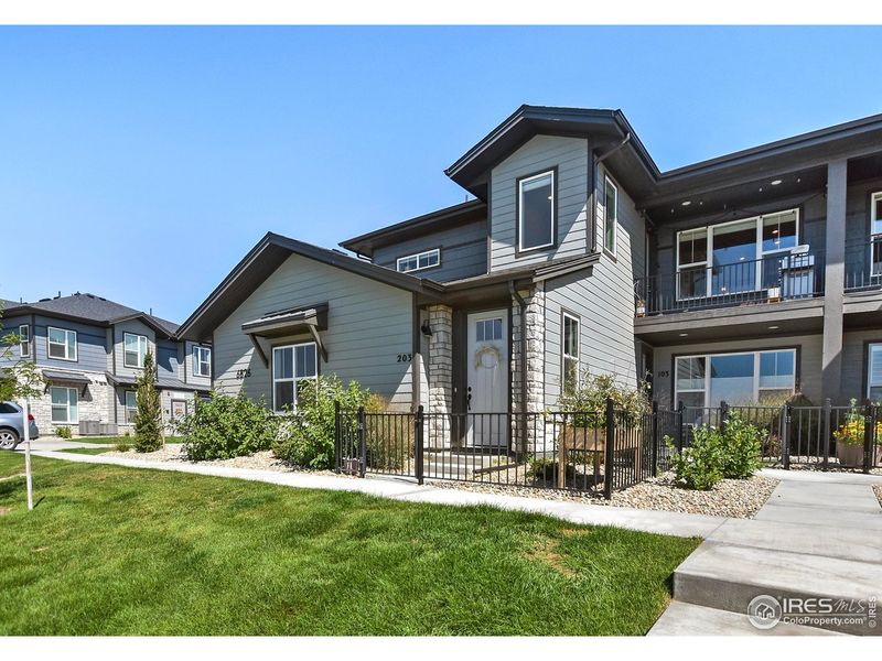 Front exterior of a new home in , Timnath, CO, highlighting curb appeal (Image 26).
