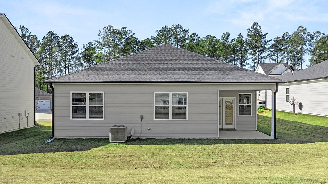 Exterior details and patio area of a home in Oakchase at Hampton, Hampton (Image 18).