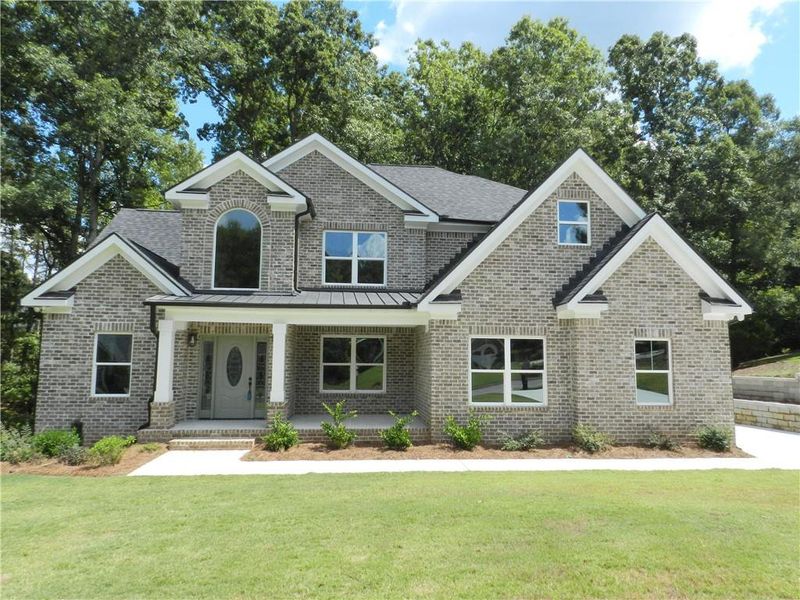 Front exterior of a new home in , McDonough, GA, highlighting curb appeal (Image 1). Front exterior of a new home in , McDonough, GA, highlighting curb appeal (Image 1).