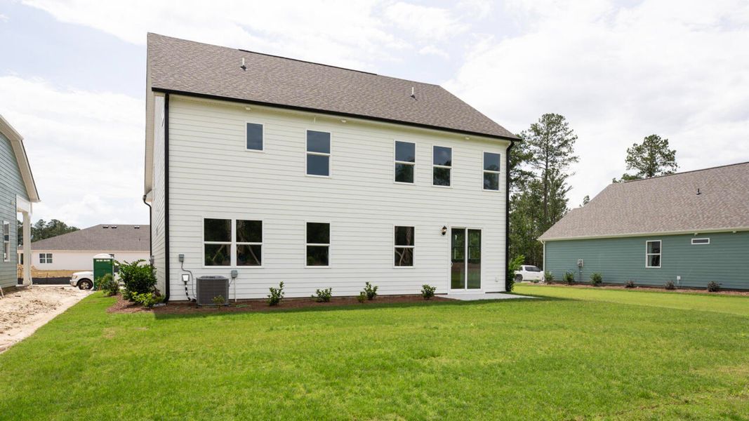 Exterior details and patio area of a home in Indigo Preserve, Leland (Image 2). Exterior details and patio area of a home in Indigo Preserve, Leland (Image 2).